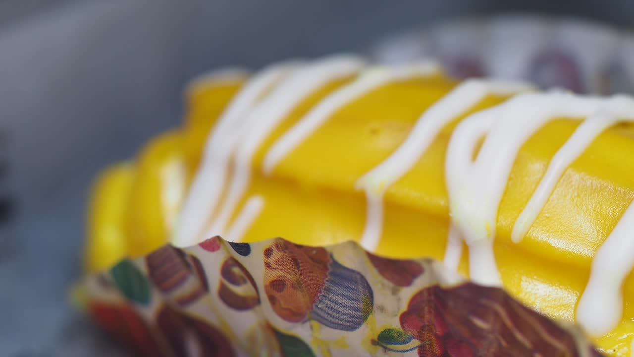 Close-up of a decorated yellow pastry