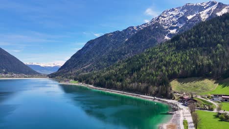 4K-drone-with-houses-and-river-Austria,-Hallstatt,Gosau