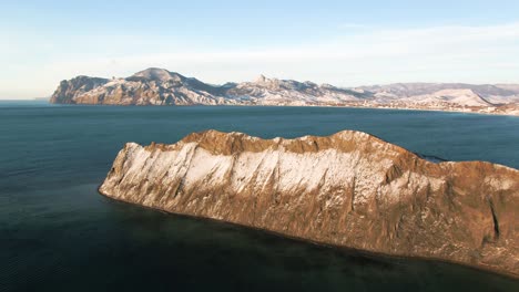 snowy mountain coastline view