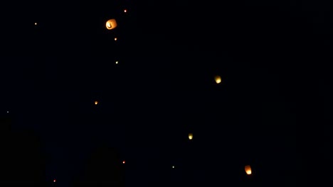 fire lantern launching close up. paper fire lantern starting to fly to the sky