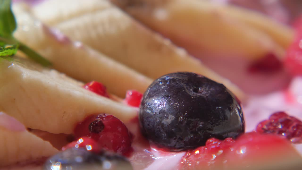 Dessert with banana, blueberry, and red currant