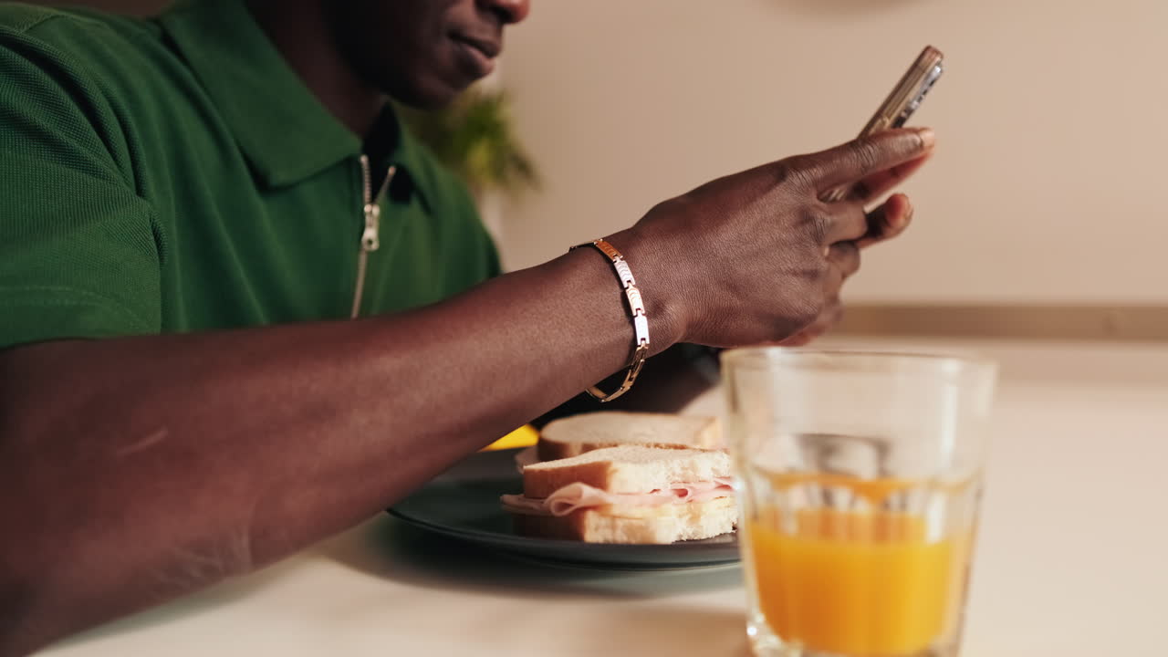 Close-up of Person Using Smartphone During Breakfast