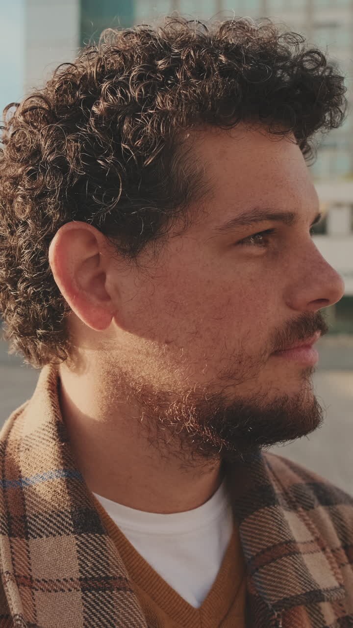 Man with Curly Hair and Plaid Jacket Portrait