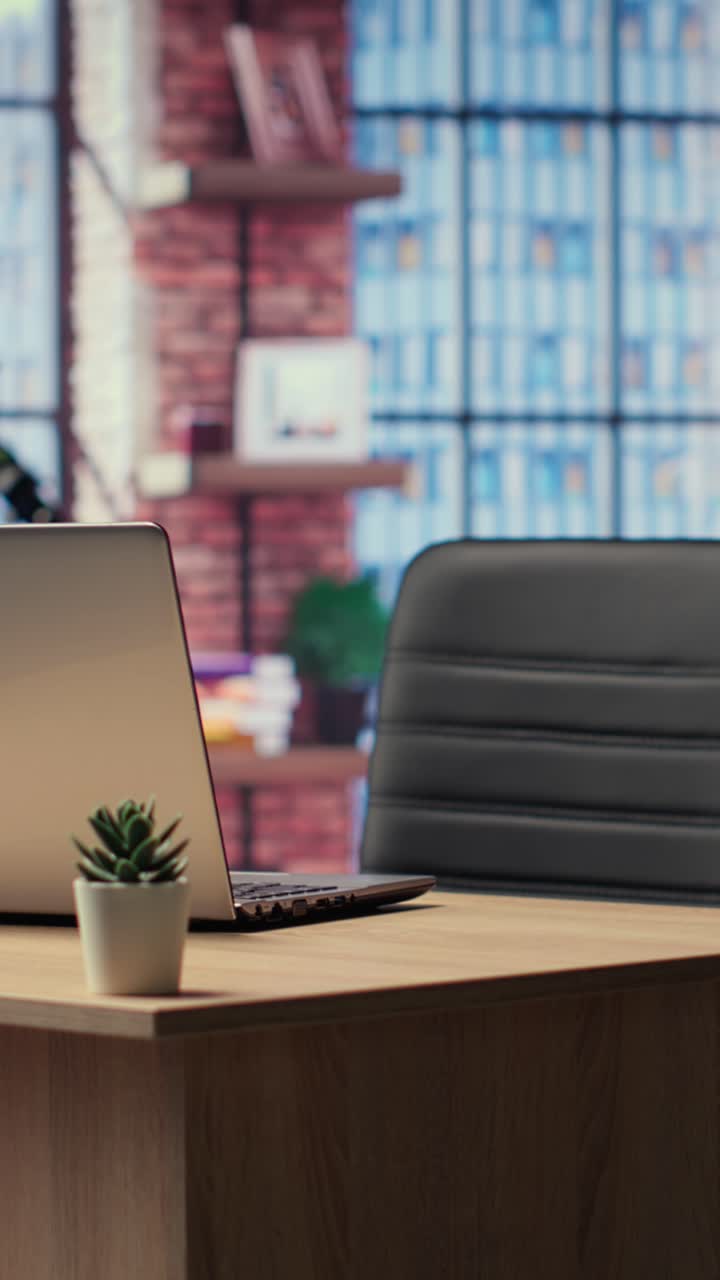 Laptop Opening on Empty Desk in Modern Office