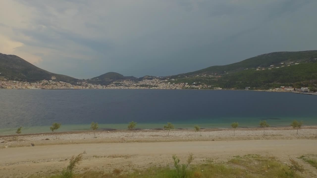 Coastal Landscape with Mountains and Town