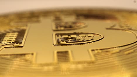 rotating golden bitcoin real coin, macro shot