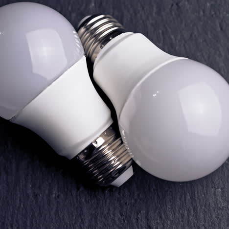 energy saving light bulb on a black background.