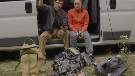 Heterosexual couple sitting in a van