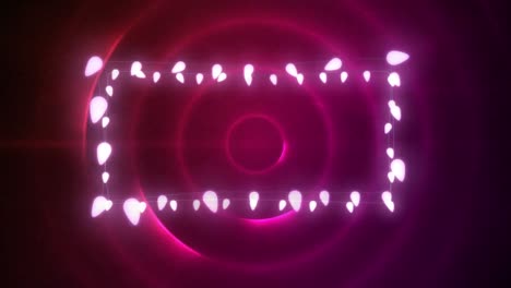 animation of christmas decoration fairy lights with copy space over pink circles