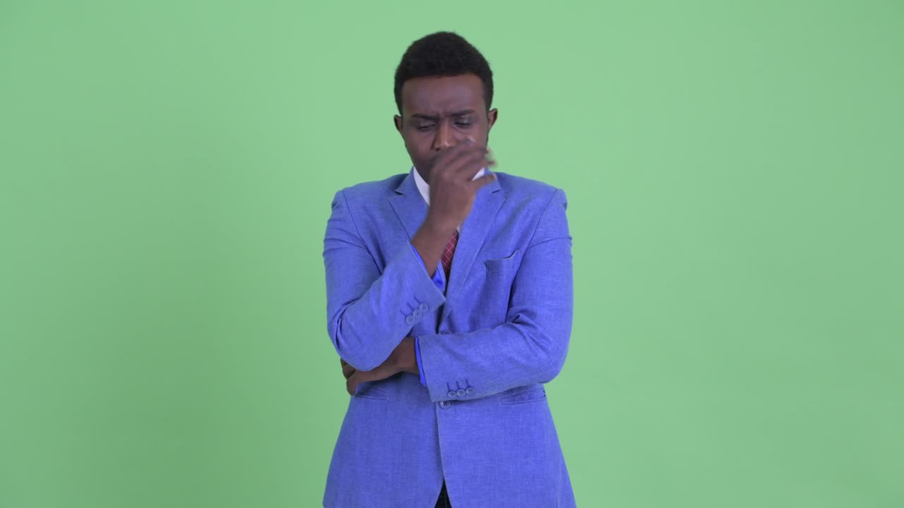 Young African businessman with Afro hair in suit