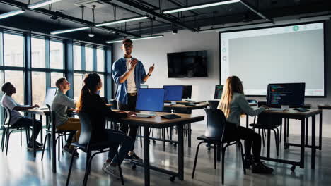 students and instructor in a modern computer programming class