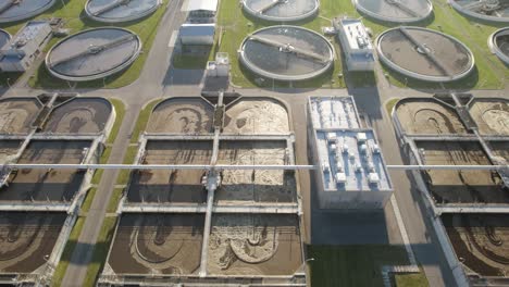 aerial trucking shot of the aeration basins and sedimentation basins in huge water clarifying plant