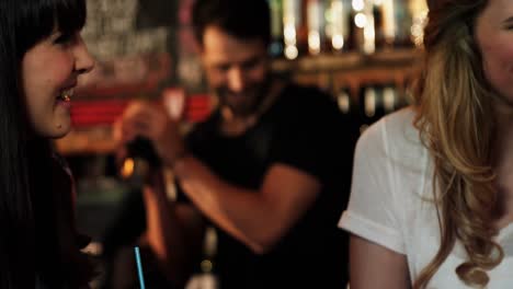 bartender preparing cocktail at bar counter