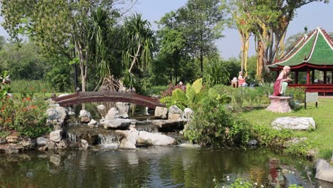 peaceful garden with pond and crossing bridge