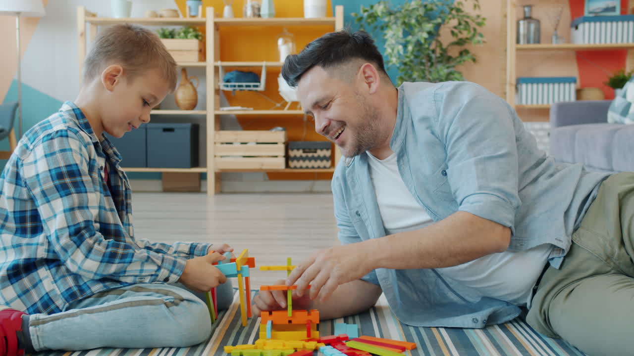 Father and Son Building with Wooden Blocks