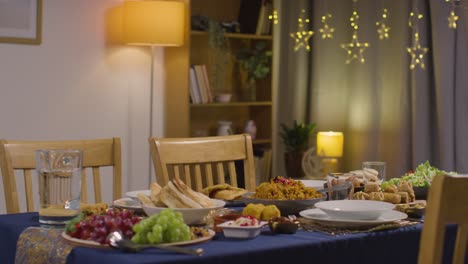 food on muslim muslim family table at home set for meal celebrating eid