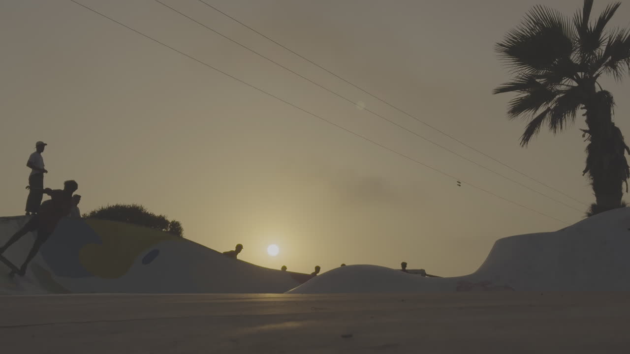 Skateboarding at Sunset in a Skate Park