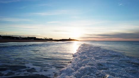 Rolling-waves-drone-footage-on-a-Portuguese-beach-during-sunrise