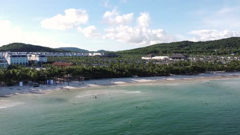 aerial descending view of emerald water beachline in phu quoc island, vietnam
