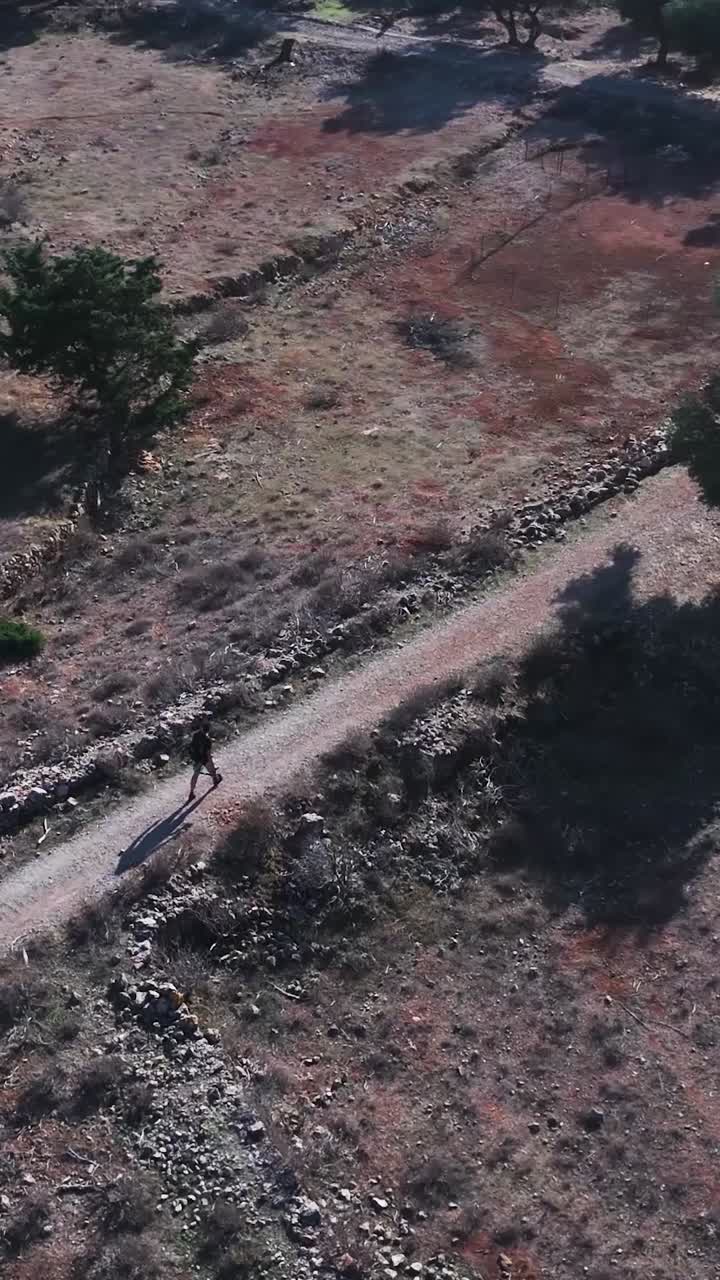 Person Hiking on a Countryside Path