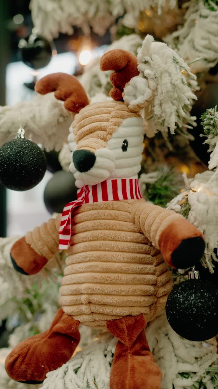 Festive Stuffed Reindeer Plush Toy with Scarf on Christmas Tree