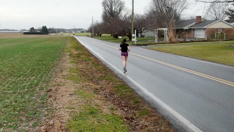 cardio workout, grit and determination of a young woman running, exercise, training, mental health theme, freedom in usa