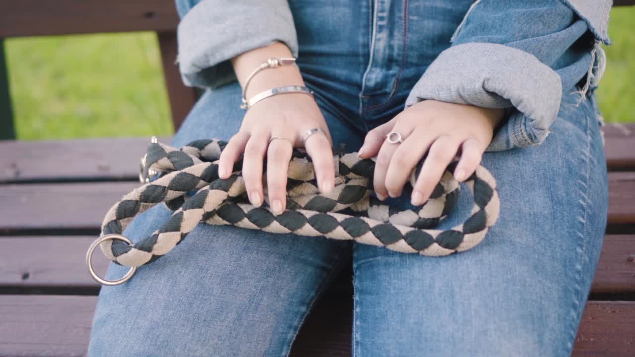 Girl holding a dog's leash