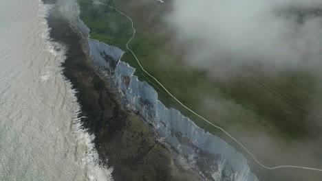 misty landscape over white cliffs of dover in kent, england, uk. - aerial shot