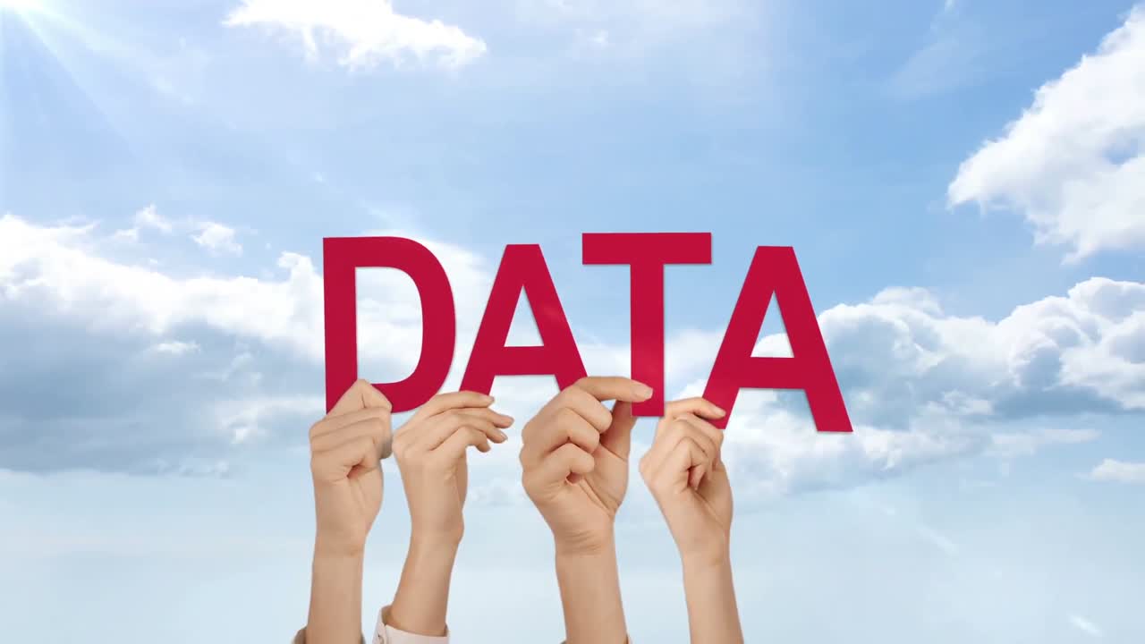 Hands holding up data