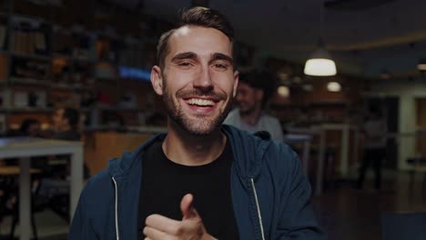 smiling man in a modern workspace