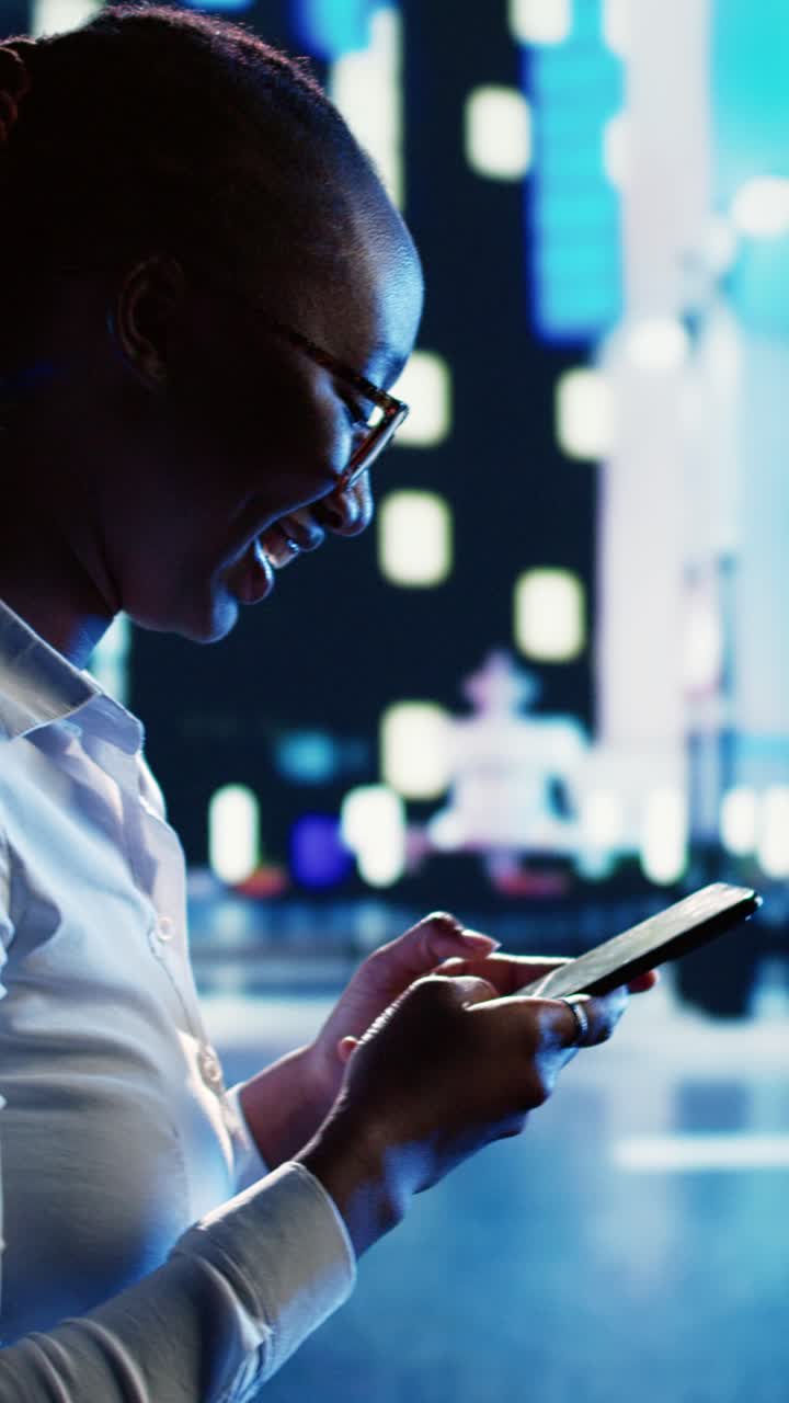 Vertical video Cheerful woman texts and walks in city