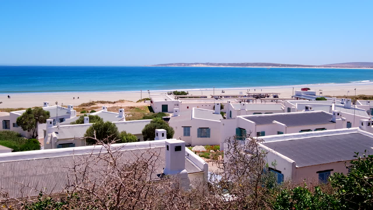 Whitewashed fishermen's cottages in scenic Paternoster on Cape West Coast overlooking idyllic turquoise Atlantic ocean