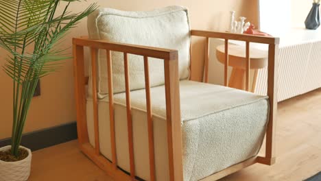 light beige wooden armchair in a modern living room