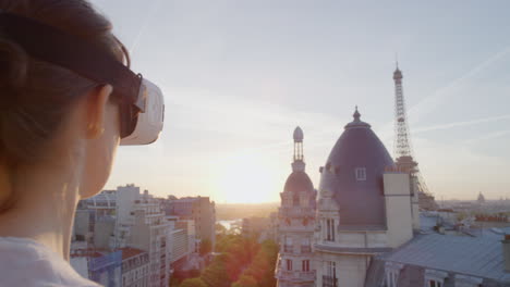 woman-using-virtual-reality-headset-enjoying-exploring-online-cyberspace-experience-on-balcony-in-beautiful-paris-sunset-close-up