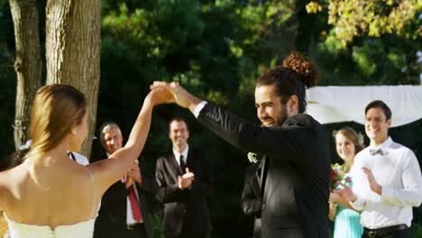 bride and groom dancing with guests clapping in background 4k 4k