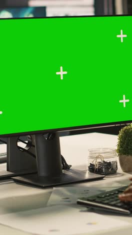 vertical video office clerk working on green screen mockup pc