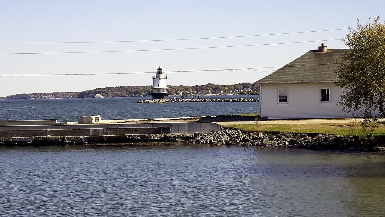 Spring Point lighthouse with tourists in South Portland, Maine