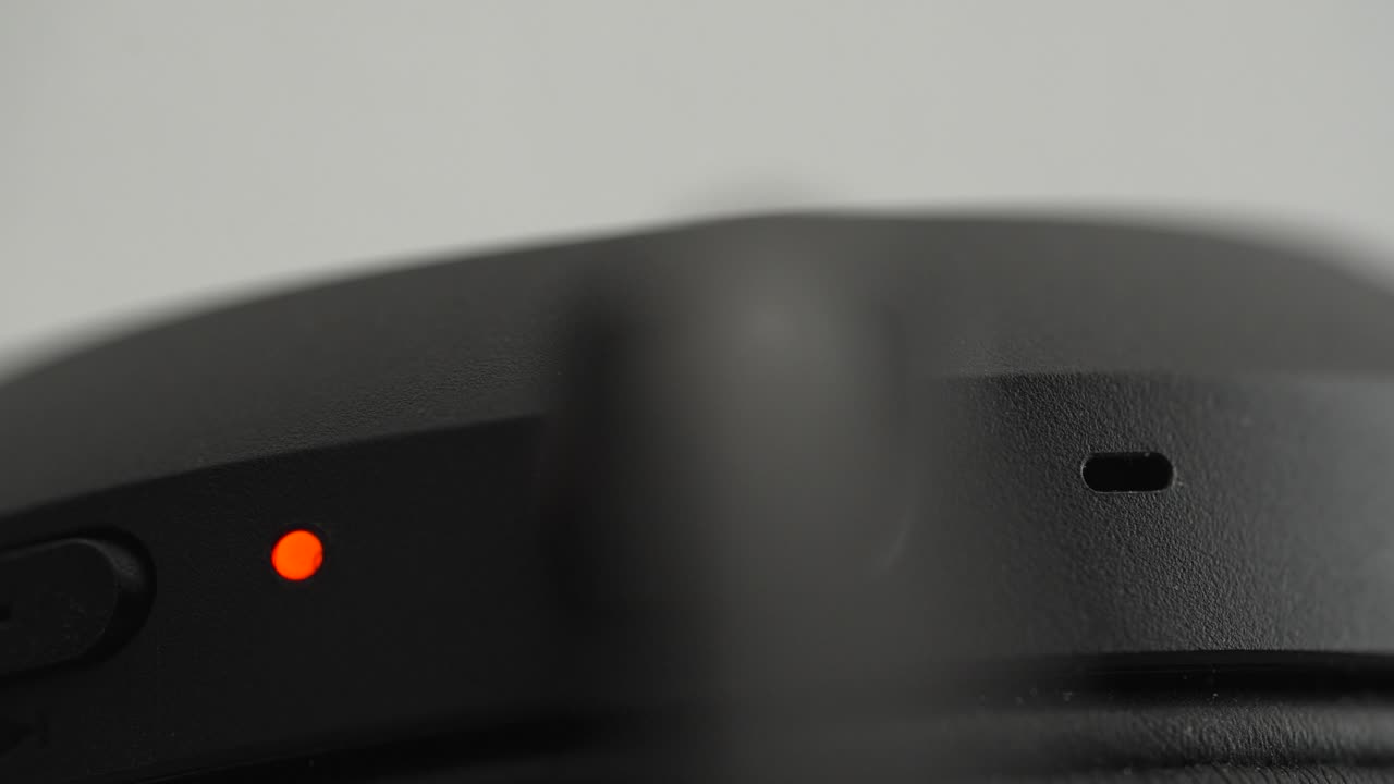 Close-Up of Charging Cable Plugging into Wireless Headphones