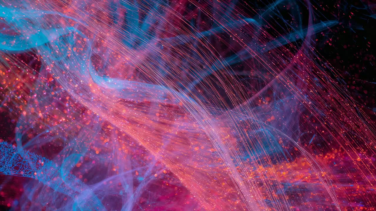 Shifting cyan and pink-orange filaments reacting to lighting shift in macro, showing orange specks