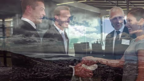 Animation-of-businessman-handshake-over-cityscape