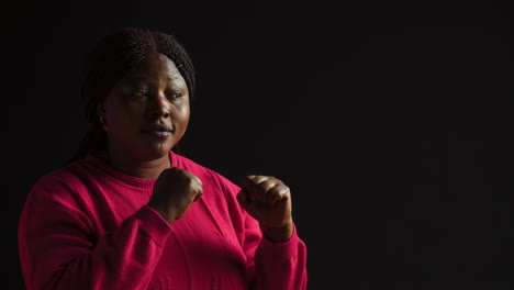 woman with clenched fist ready for fight