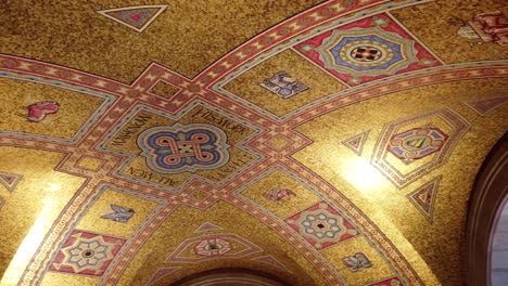 Panning-shot-of-an-ornate,-artistic-ceiling