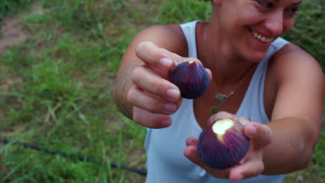 CLOSEUP-of-a-caucasian-woman-showing-handful-of-fresh-figs