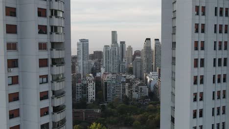 Spectacular-aerial-view-between-two-skyscraper-and-skyline-of-Buenos-Aires-in-background