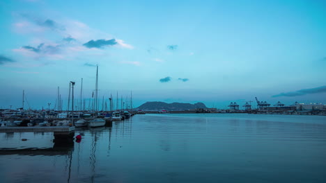 time lapse port harbour with boats at sunrise with clouds moving in spain