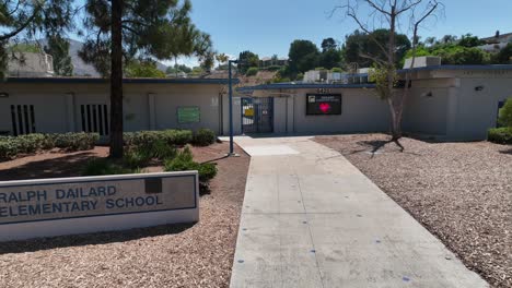 Dailard-Elementary-School-Outside-Entrance-Door-and-Concrete-Sign-in-San-Carlos-Community,-San-Diego-California,-Outdoor-Building-Facade-of-Educational-Academic-Institution