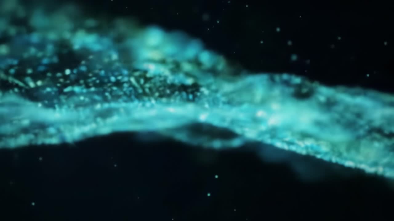A mesmerizing display of ethereal waves and glimmering particles captured in captivating motion, showcasing the beauty and fluidity of digital art and nature combined.