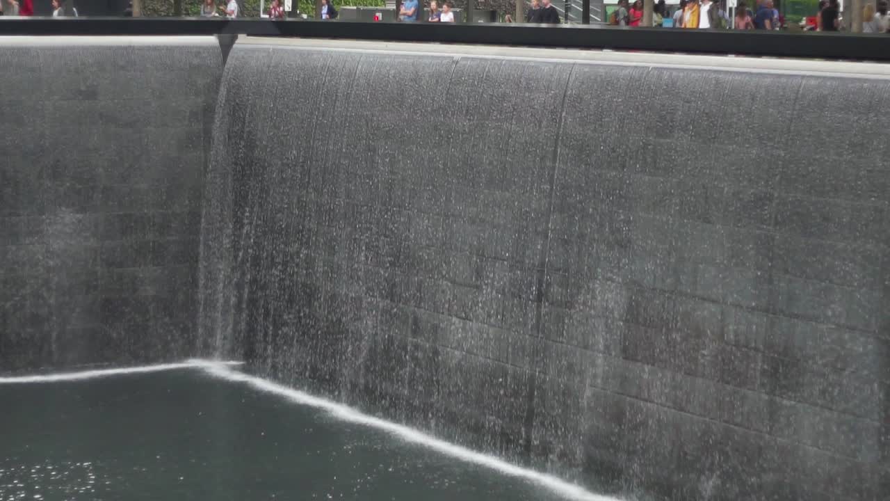 North Pool at September 11 Memorial and Museum, New York USA. Fall Slow Motion