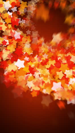 bright colorful fireworks explosion with yellow and red stars on a dark night background. looped cartoon animation. copy space. vertical video.