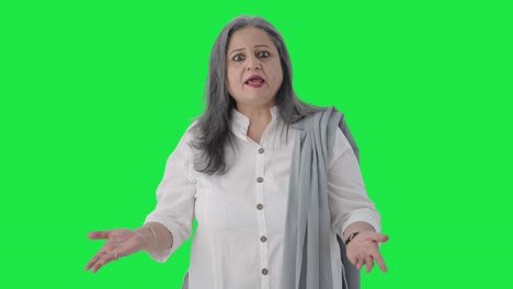 Angry-Indian-senior-businesswoman-shouting-Green-screen